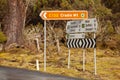 Road intersection with road signs at the turnoff to Cradle Mountain Royalty Free Stock Photo