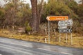 Road intersection with road signs at the turnoff to Cradle Mountain Royalty Free Stock Photo