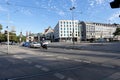 A road intersection with traffic lights in the city of Munich.