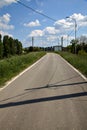 Road in the italian countryside in spring on a clear day Royalty Free Stock Photo