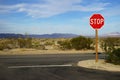 A road junction with a stop sign in Joshua Tree National Park, USA Royalty Free Stock Photo