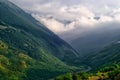The road in Karmadon Gorge and river Genaldon summer view. The Caucasus Mountains Royalty Free Stock Photo