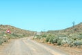 Road landscape, with uneven roadway sign, on historic Postal Route Royalty Free Stock Photo