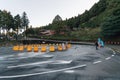 Road lanes that lead to Alishan train station in the morning with security guard in Alishan, Taiwan