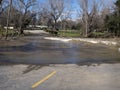 Road leading into deep flood water Royalty Free Stock Photo