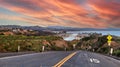 Sunset over Road leading down to Dana Point Harbor Royalty Free Stock Photo