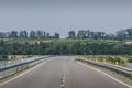 Road leading through the Pasohlavky reservoir without cars on a sunny day.