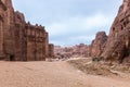 The road leading between the red rocks in Petra - the capital of the Nabatean kingdom in Wadi Musa city in Jordan