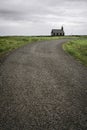 Road leading to Black wooden church Budakirkja in Iceland