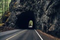 Entrance to car tunnel in rocky mountains. Generative AI Royalty Free Stock Photo