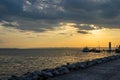 Road leading to the lighthouse in the town of Podersdorf on Lake Neusiedl in Austria. In the background is a dramatic sunset sky Royalty Free Stock Photo