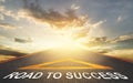 Road leading to success with golden sky as a goal for business successs concept