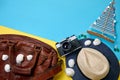 Road leather bag, straw hat, vintage photo camera, seashells and sailing yacht