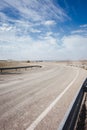 Road, sky and left curve