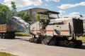 Road machinery repairs the road