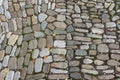 The road is made of smooth stones. Cobblestone texture Royalty Free Stock Photo