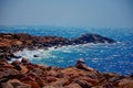 Road is made of stones, leading to the sea. Waves break on the rocks of a wild lonely beach. The Mediterranean Sea in Israel Royalty Free Stock Photo