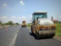 Road maintenance by burning old materials and improving quality Royalty Free Stock Photo
