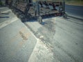 Road maintenance by burning old materials and improving quality Royalty Free Stock Photo