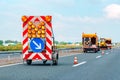 Road maintenance truck and signalization for road works Royalty Free Stock Photo