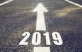 Road marking in form of 2019 year and arrow