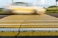 Road marking pedestrian crossing on cracked asphalt, moving car through pedestrian crossing or zebra lines Royalty Free Stock Photo