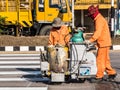 Road Marking Workers at Work. Royalty Free Stock Photo