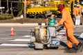 Road Marking Workers at Work Under Scorching Sun.