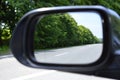 The road with markings is reflected in the side view mirror Royalty Free Stock Photo