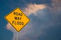 Road May Flood Sign Against A Blue Sky and Storm clouds. Royalty Free Stock Photo