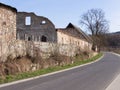 Road beside a medieval wall and a ruinous building, Siedlecin, Poland