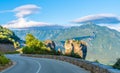 Road on Meteora region, in backround Trinity Monastery, Meteora Royalty Free Stock Photo