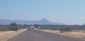 Road; mountain; winter; cars; veld Royalty Free Stock Photo