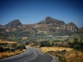 Road in the mountains against clear blue sky in Crete, Greece, June 2008 Royalty Free Stock Photo