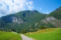 Road in mountains in Flam, Norway. Country road on mountain landscape. Beauty of nature. Hiking and camping. Summer trip