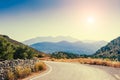 Road between the mountains and groves of olive trees Royalty Free Stock Photo