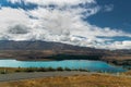 Road in the mountains, Lake Tekapo, and dramatic cloudy sky, North Island New Zealand Royalty Free Stock Photo