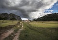 A road in the mountains and a mountain house Royalty Free Stock Photo