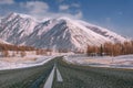 Road mountains snow winter trees Royalty Free Stock Photo