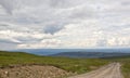 Gravel Road in Scandinavian Mountains on Cloudy Day Royalty Free Stock Photo