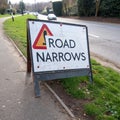 Road narrows sign isolated on white background Royalty Free Stock Photo