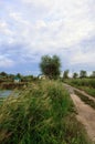 Road near river under cloudy sky Royalty Free Stock Photo