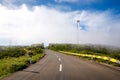 The road near wind propeller turbines. Green energy concept. Royalty Free Stock Photo