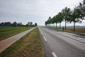 Road network in Netherlands, high quality roads in countryside, landscape with fields, road and bicycle line