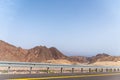 A road next to a mountainous desert landscape. Road 12 on the way to Eilat, Israel, on the Egyptian border. Mountains in