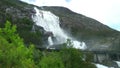Road in Norway passing over the waterfall Langfoss