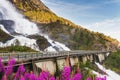 Road in Norway passing over the waterfall Langfoss