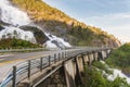 Road in Norway passing over the waterfall Langfoss