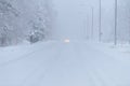 The road number 496 has covered with heavy snow and bad weather in winter season at Tuupovaara, Finland