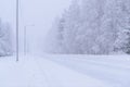 The road number 496 has covered with heavy snow and bad weather in winter season at Tuupovaara, Finland